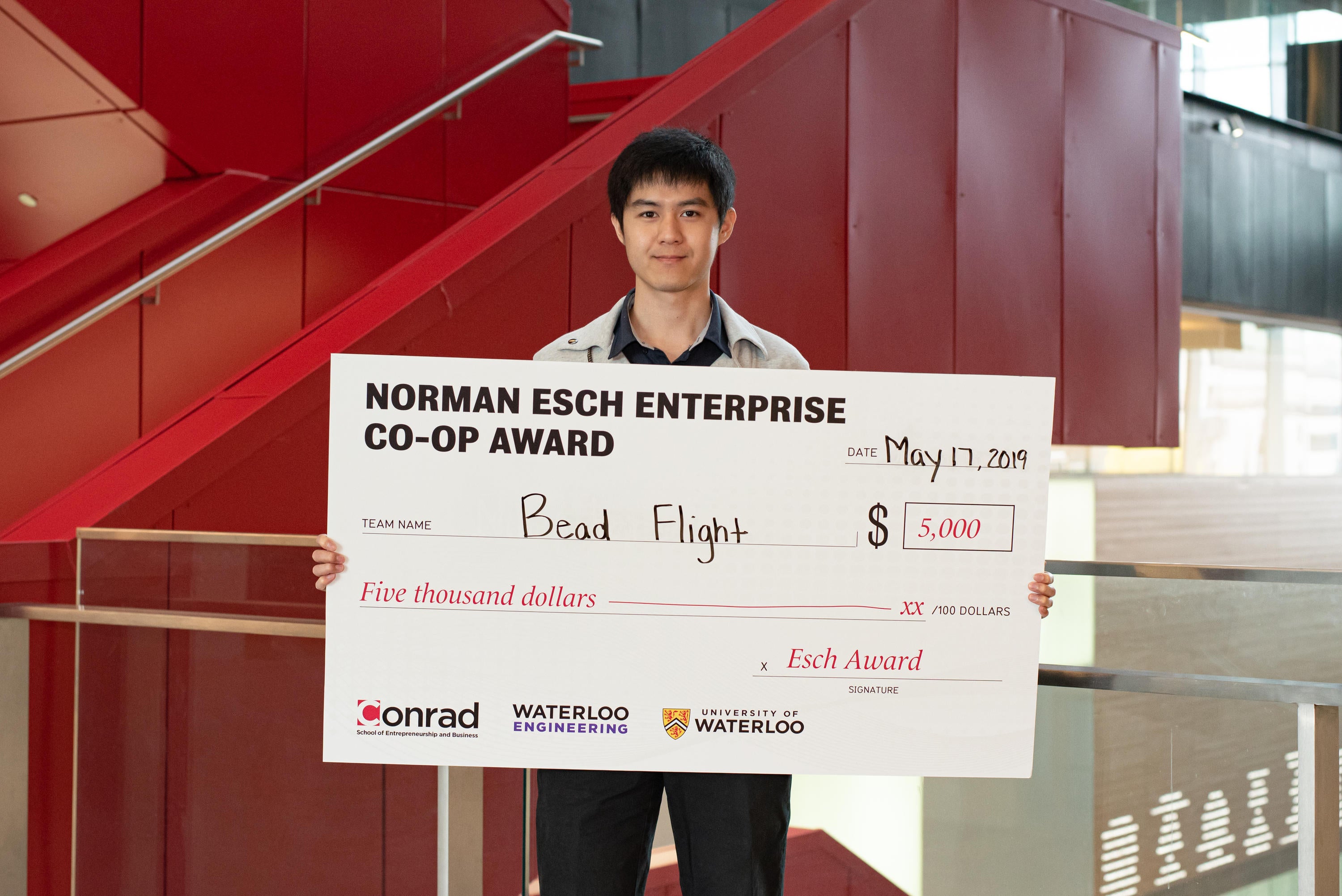 Terrence Chan with award cheque.