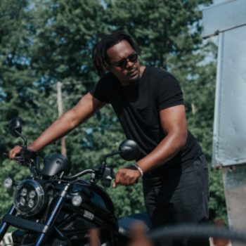 Jerome Mugambi on bike MBET alum