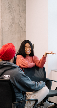MBET students sitting in conversation