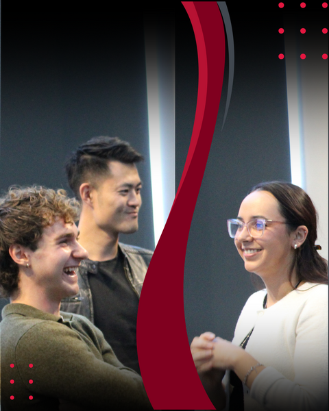 Students smiling at event