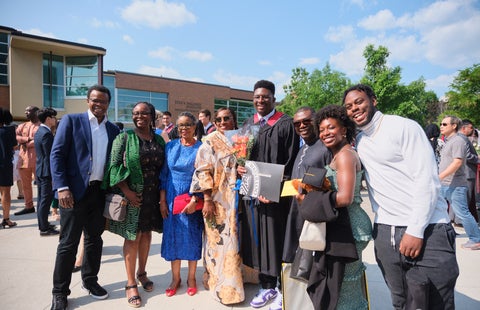 Graduating student with guests