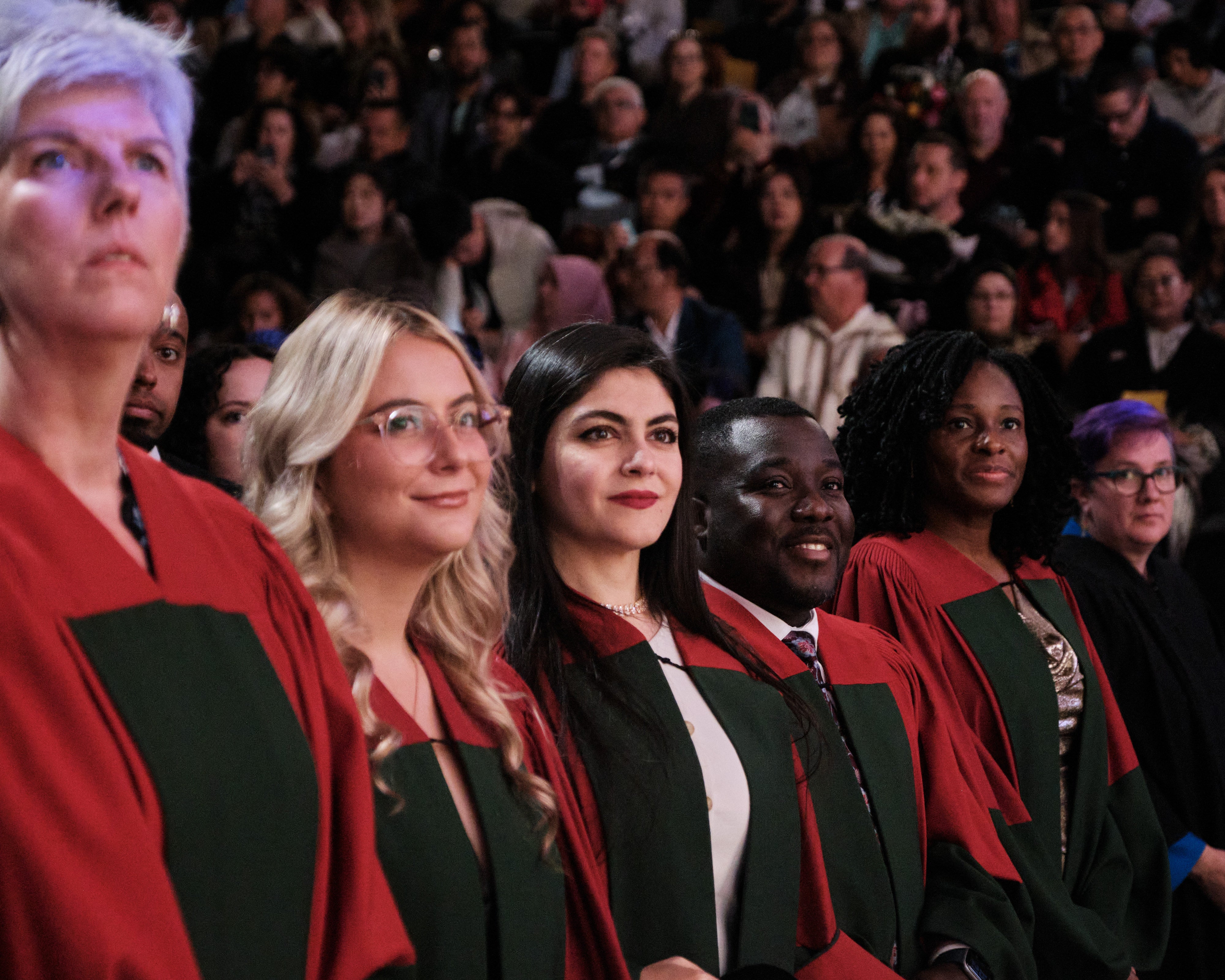 Grads standing at Convocation 