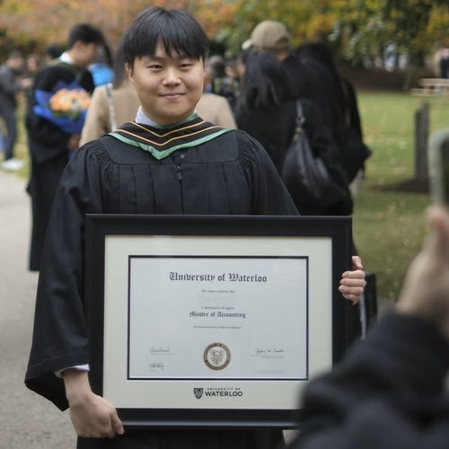 Graduate with diploma in frame