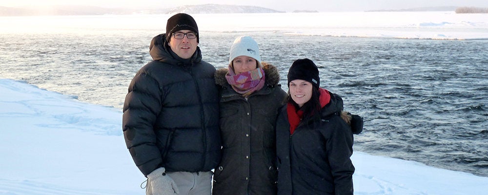 Bryan Grimwood and two graduate students in front of snowy Thelon River.