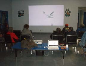 Community members viewing a film at the movie night