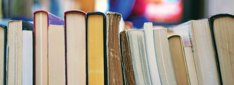 Side view of books stacked horizontally