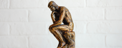 A statue in a thinking position