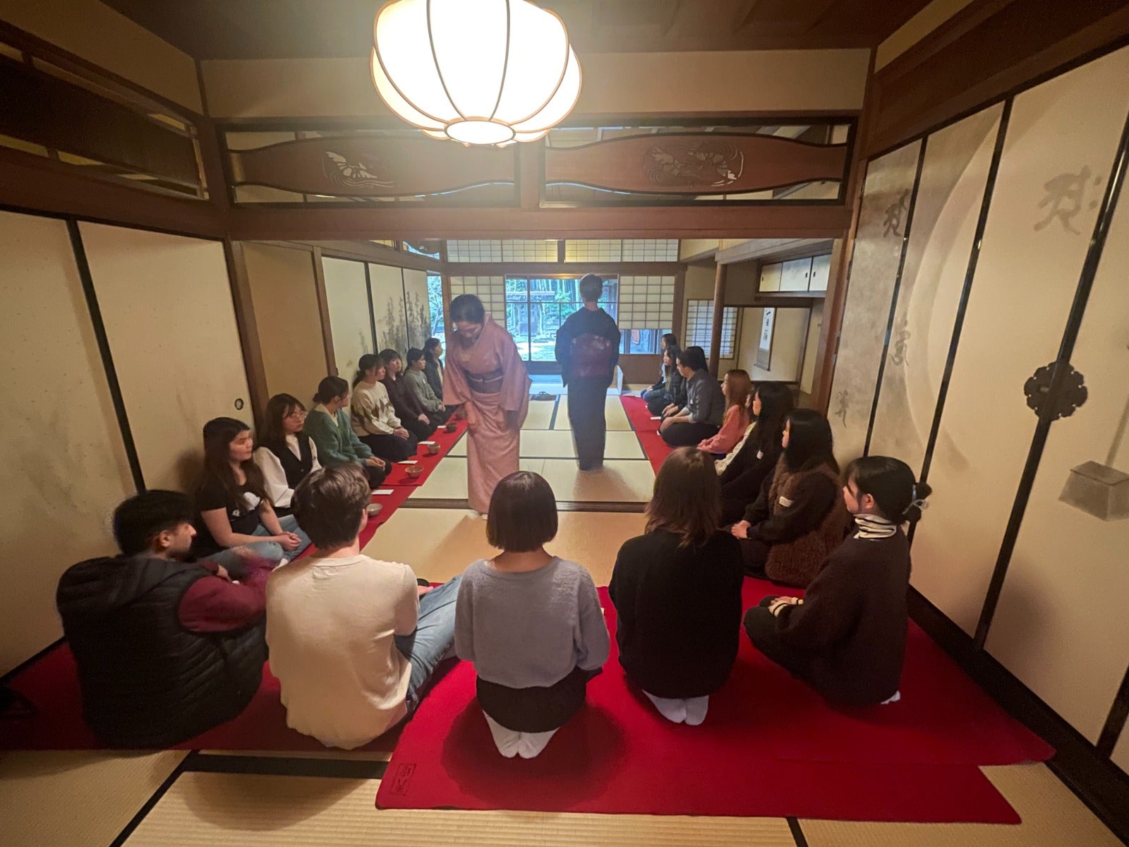 Students participate in a tea ceremony. 