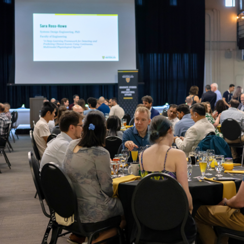 PhD grad celebration attendees sitting at the dinner table