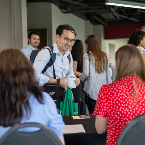 PhD grad celebration attendee checking-in for the event