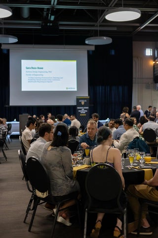 People sitting around tables at the PhD celebration.