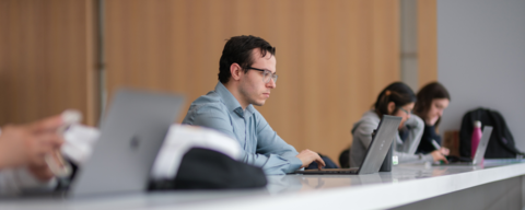 Student looking at laptop