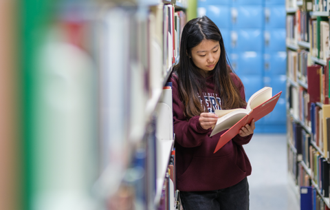 Student reading in the library