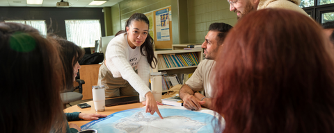 Students looking at a map together
