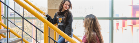 Two students walking on stairs in DC