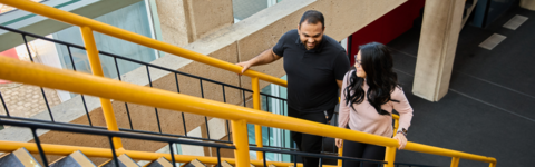 Two students walking up stairs in DC