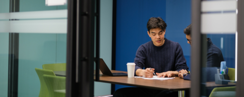 Two students working in a study room