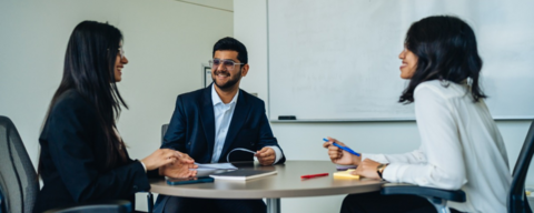 Students talking at a table