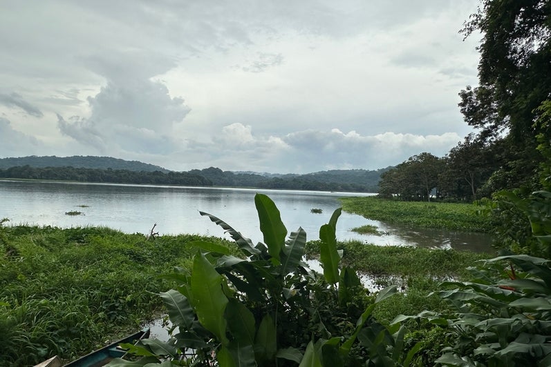 A landscape in Panama featuring a lake with hills in the background.