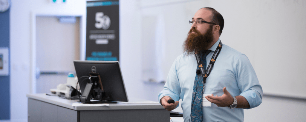 Professors giving prospective students a mock lecture.