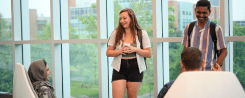 Students standing and talking in the Student Life Centre