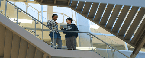 Students talking on staircase