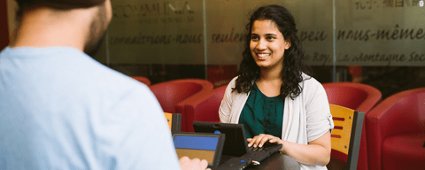 Two students using accessibility devices
