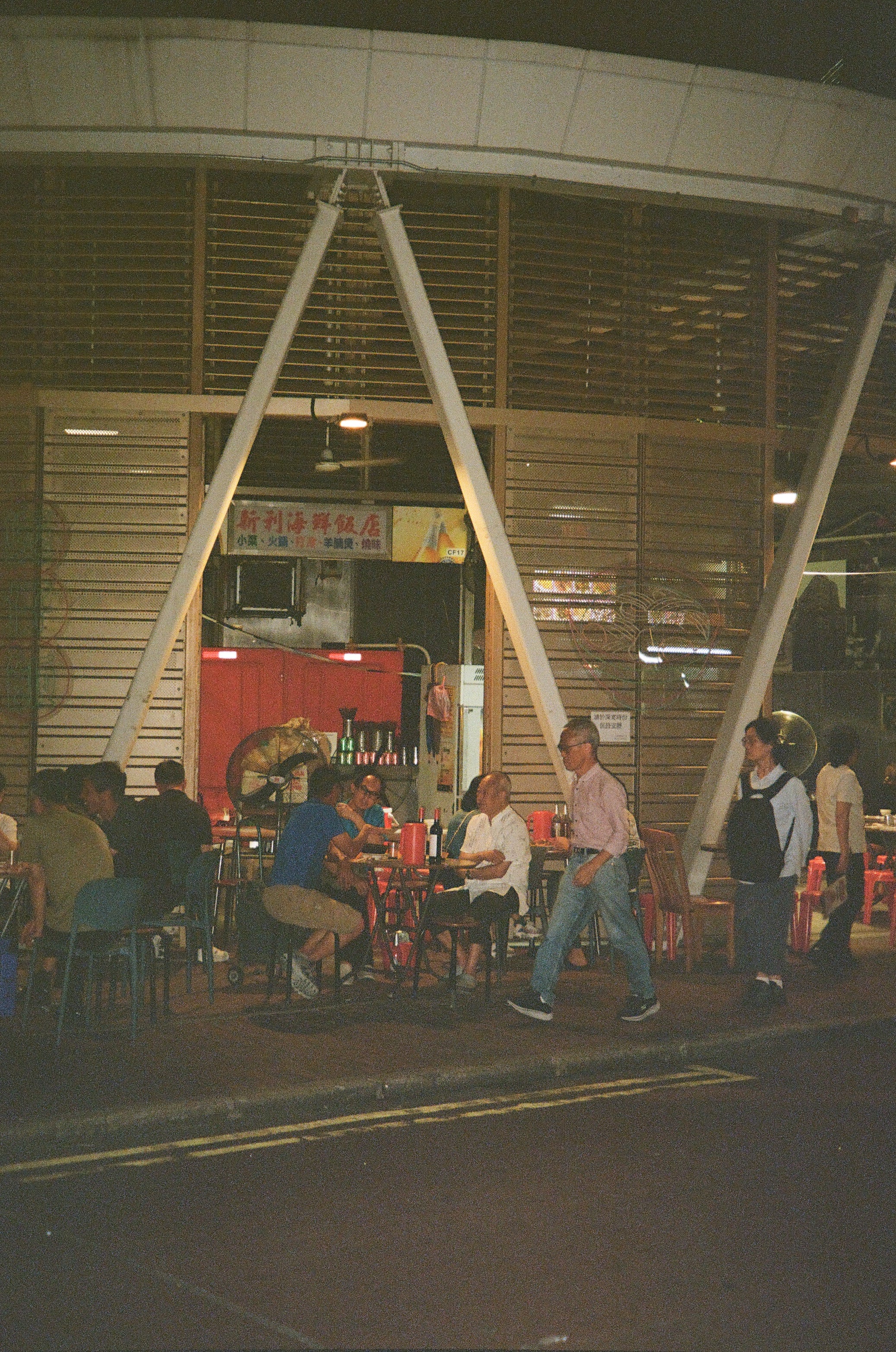 An outdoor seating area on a street in Hong Kong
