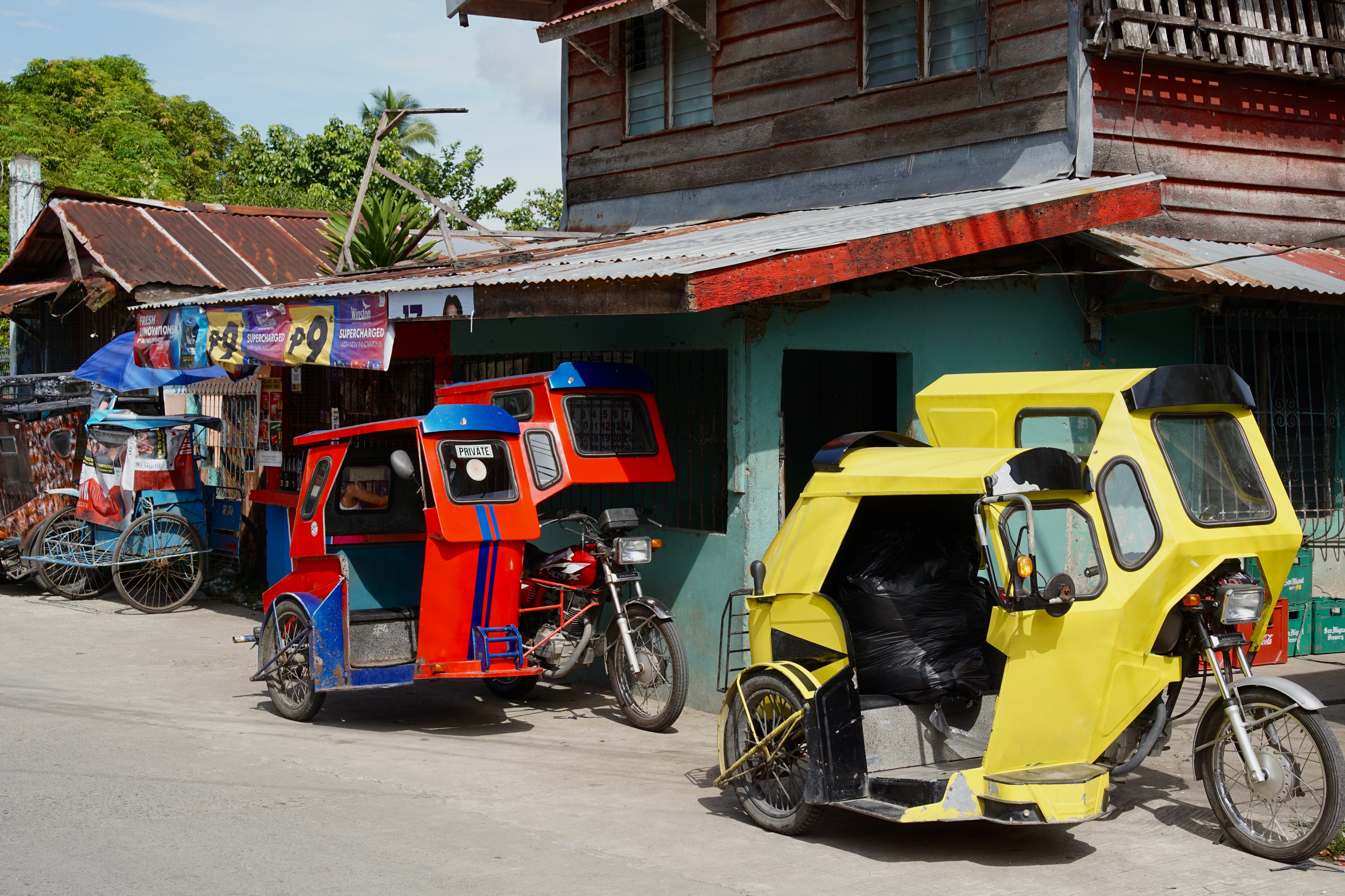 Motorcycle taxis on the street in the Phillipines