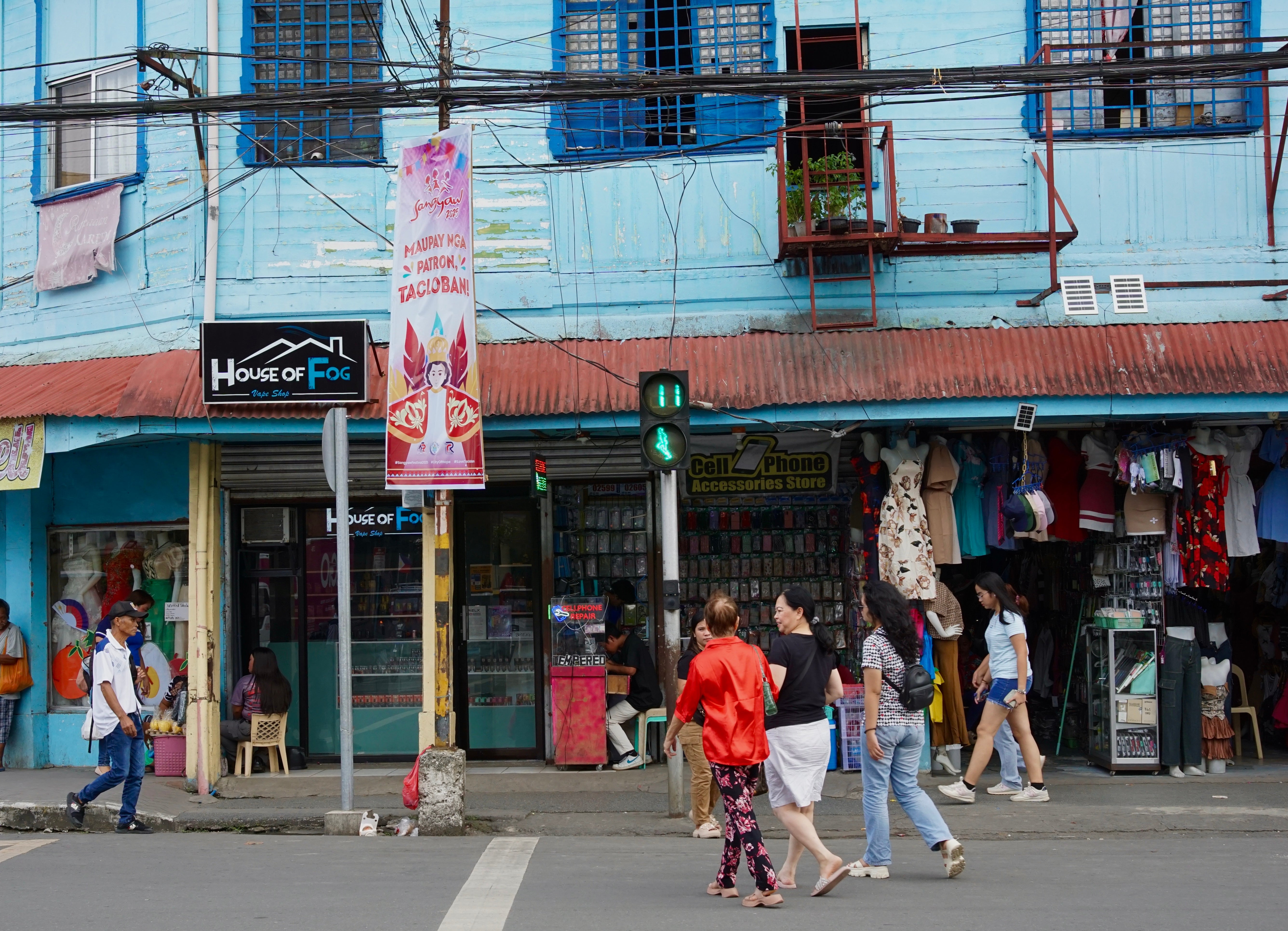 People walking in a shopping district in the Phillipines