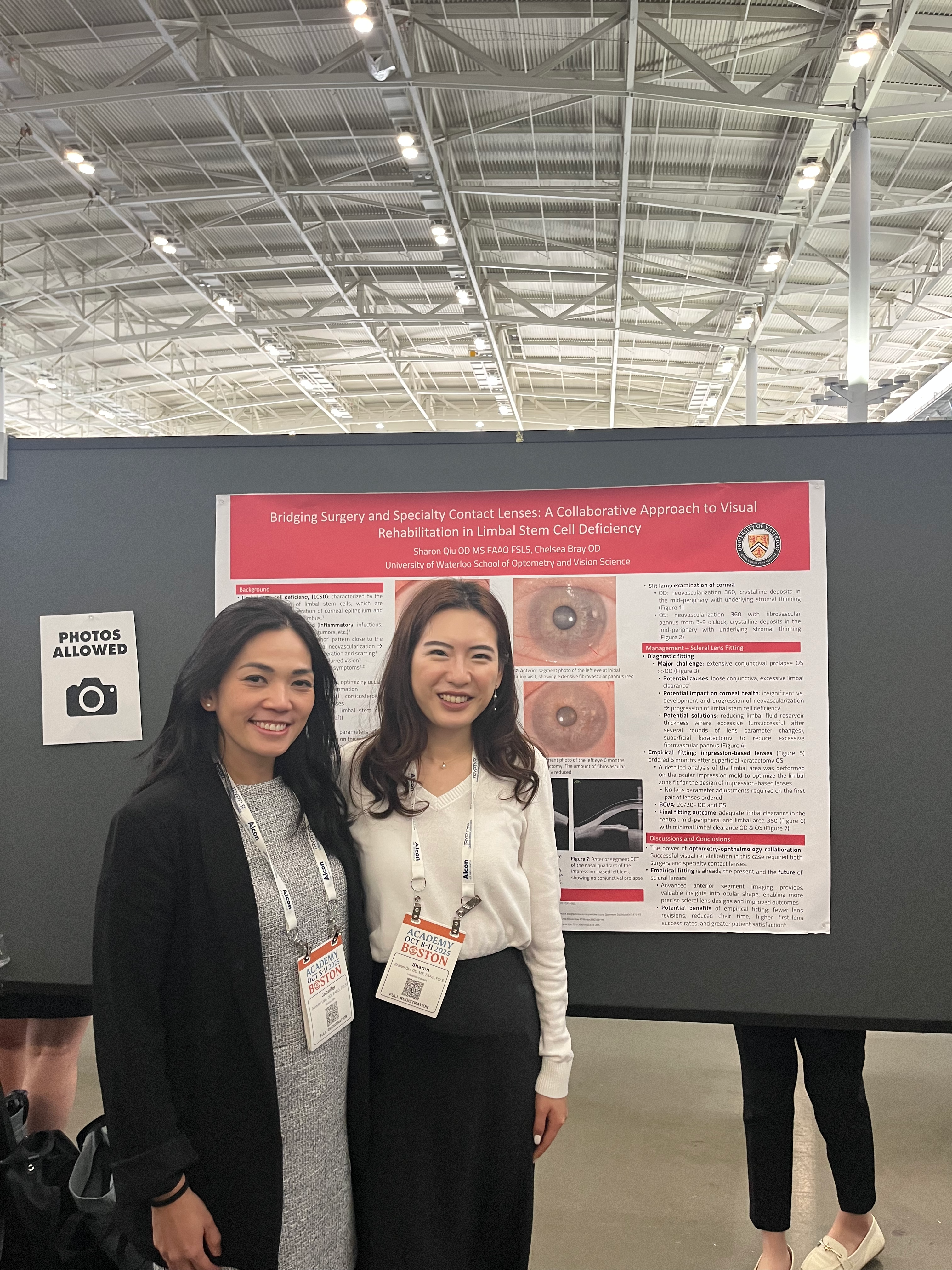 Sharon Qiu standing with another person in front of a printed out presentation poster