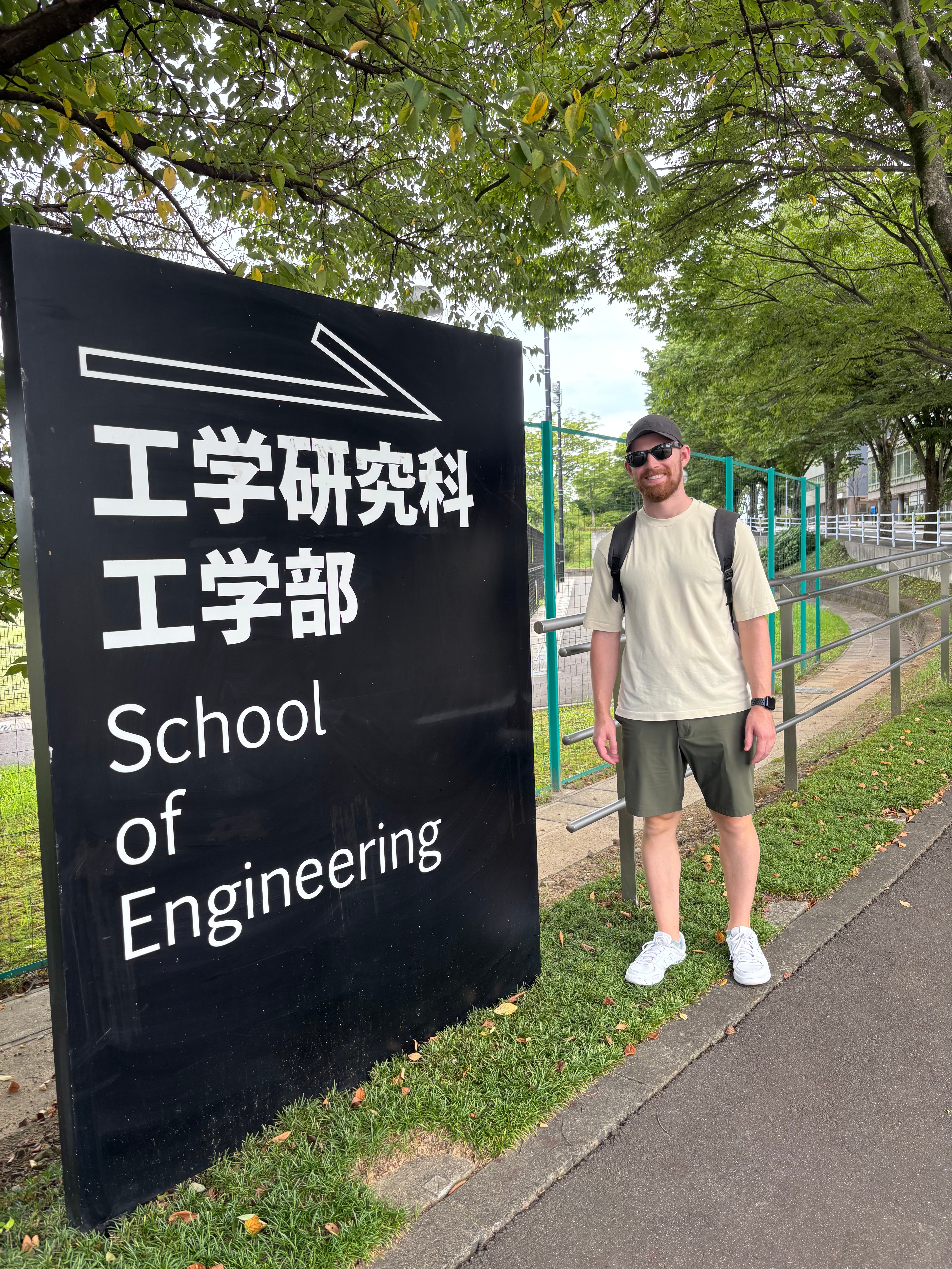 Jeremy Cohen standing in front of a sign that reads: "School of Engineering"