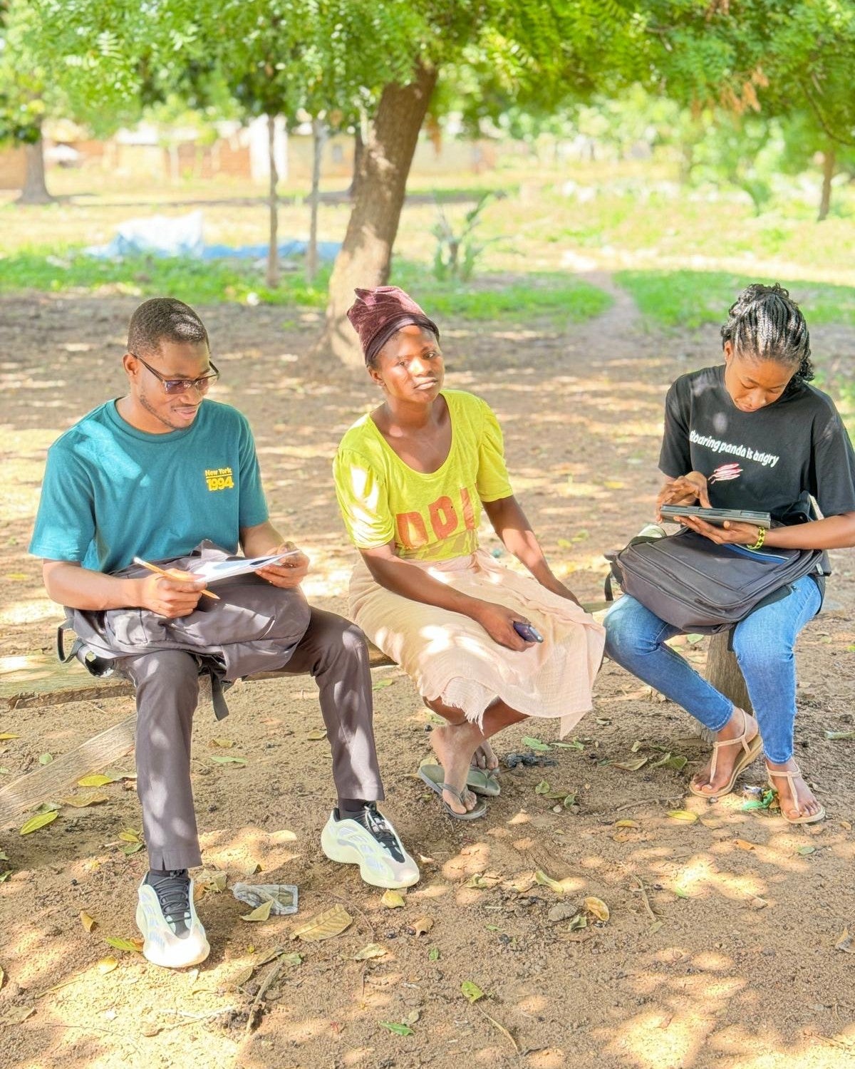 Julius with two women in Ghana