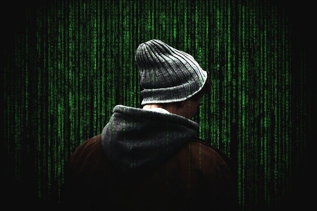 Photograph of a hacker from the back