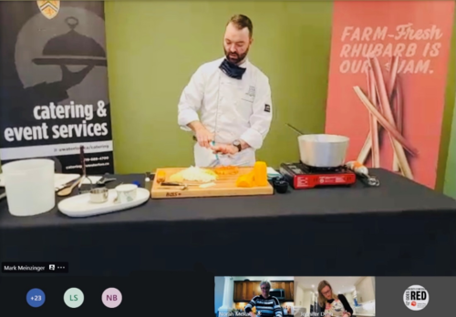 Chef Mark Meinzinger demonstrates cooking techniques over zoom.