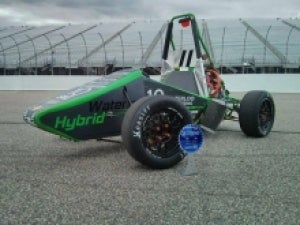 Formula Hybrid car and its trophy.