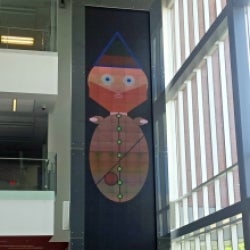 A character appears on the Christie Digital MicroTile wall at Stratford.