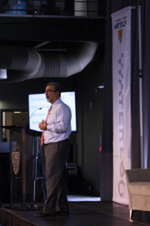 Feridun Hamdullahpur speaks at a town hall meeting.