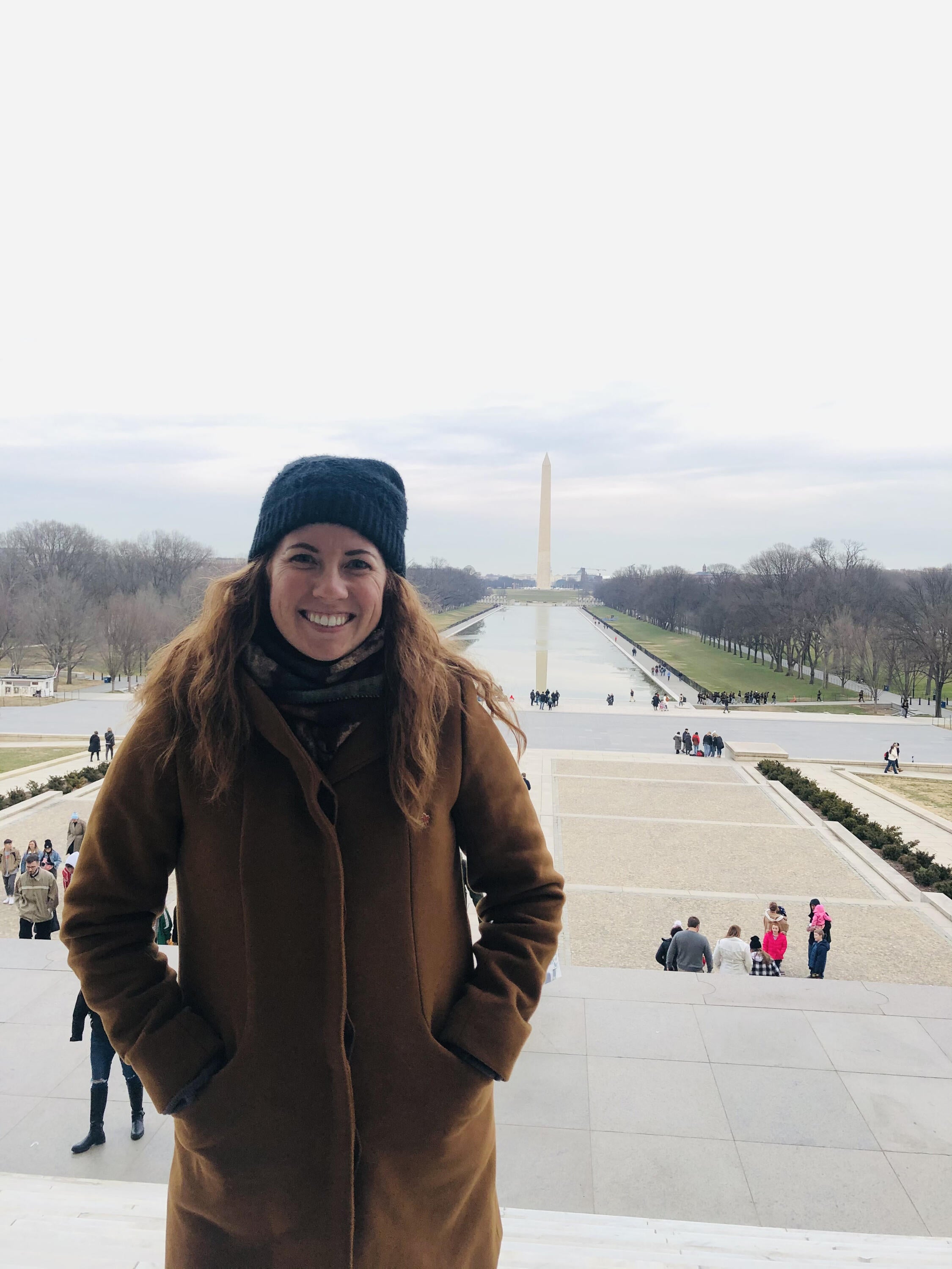Shannon Nash in Washington DC with the National Mall and the Washington Monument behind her.