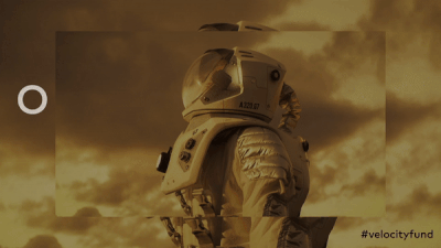 An astronaut looks around at a sepia-toned sky.