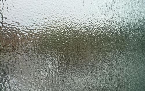A campus window obscured by a coating of ice.