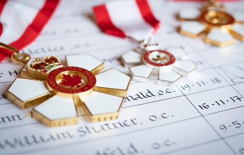 Photograph of the red and white Order of Canada medal