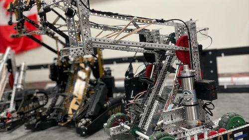 Robots built from Meccano-style chains, gears, and girders.