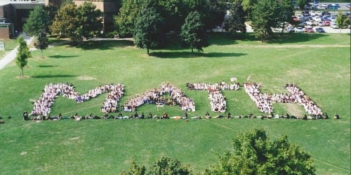 Students form the word &quot;Math&quot; on a field for an aerial photo.