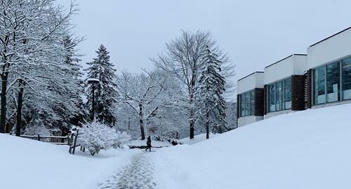 South Campus Hall with snow on the trees nearby.
