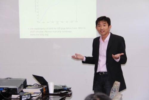 Professor Ken Seng Tam delivers a presentation.