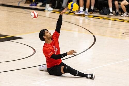 Nasif Chowdhury putting in a serve at an exhibition event at the Waterloo Physical Activities Complex.