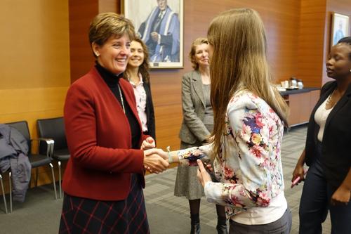 Minister Marie-Claude Bibeau greets a student at the roundtable event.