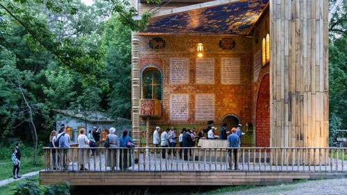People enter the Babyn Yar outdoor synagogue.