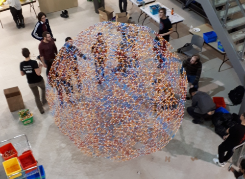Members of the Faculty of Mathematics assemble the omnitruncated dodecaplex in the M3 Atrium.